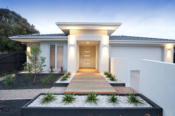 Facade and entry to a contemporary white rendered home in Australia